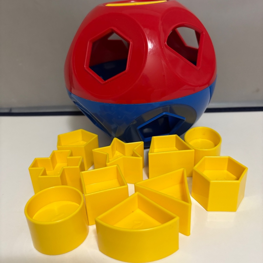 Tupperware Bright Red and Yellow Shape O Ball Toy